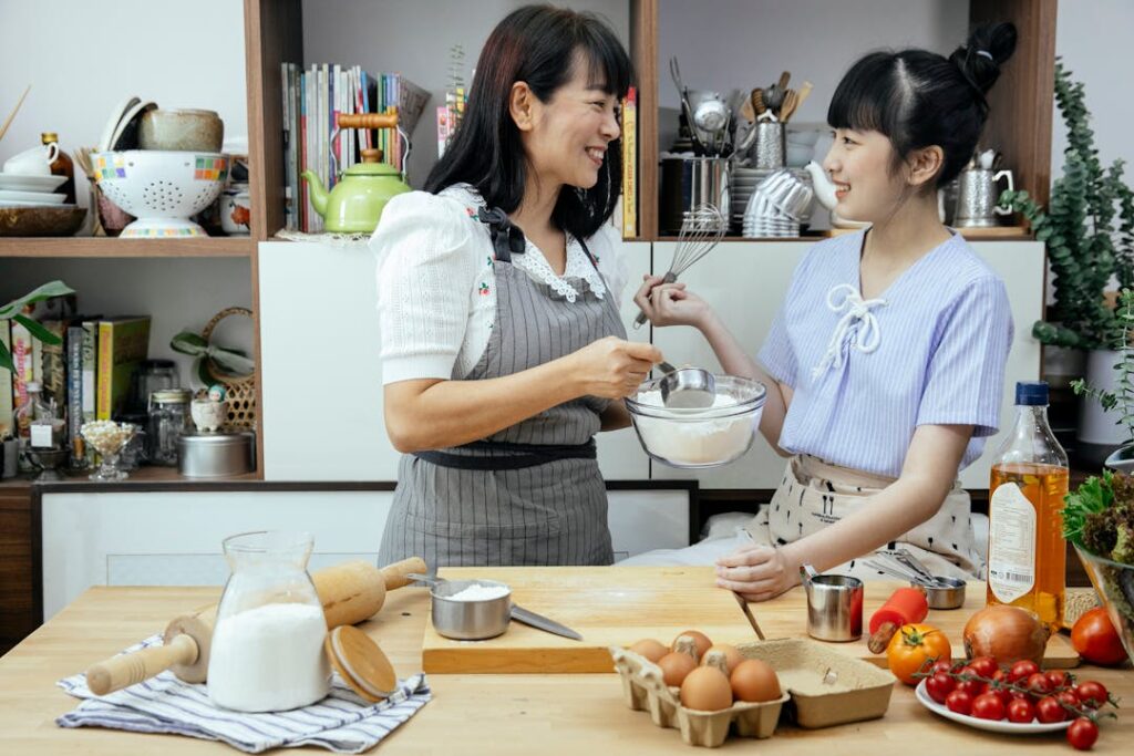 Two ladies talking in a kitchen