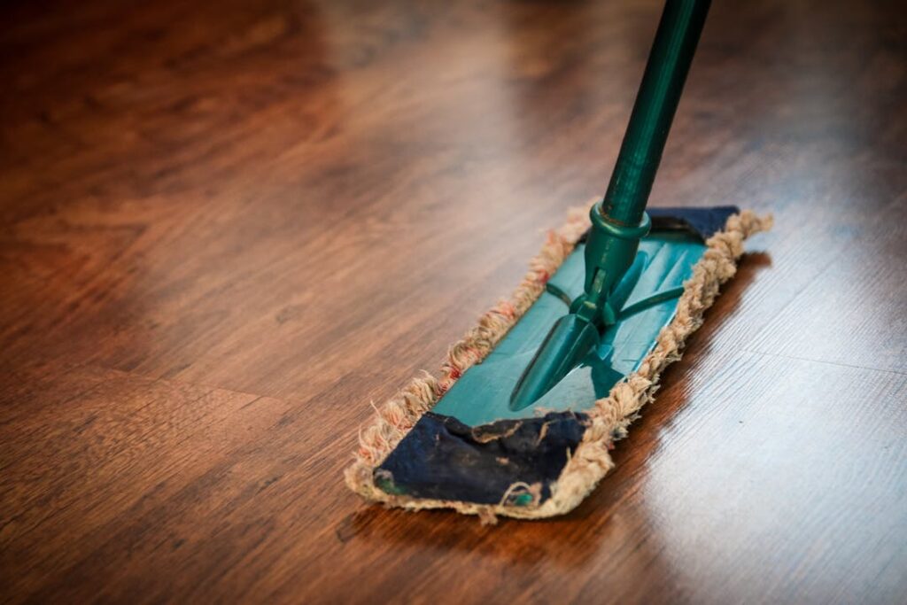 A mop on a wooden shiny floor