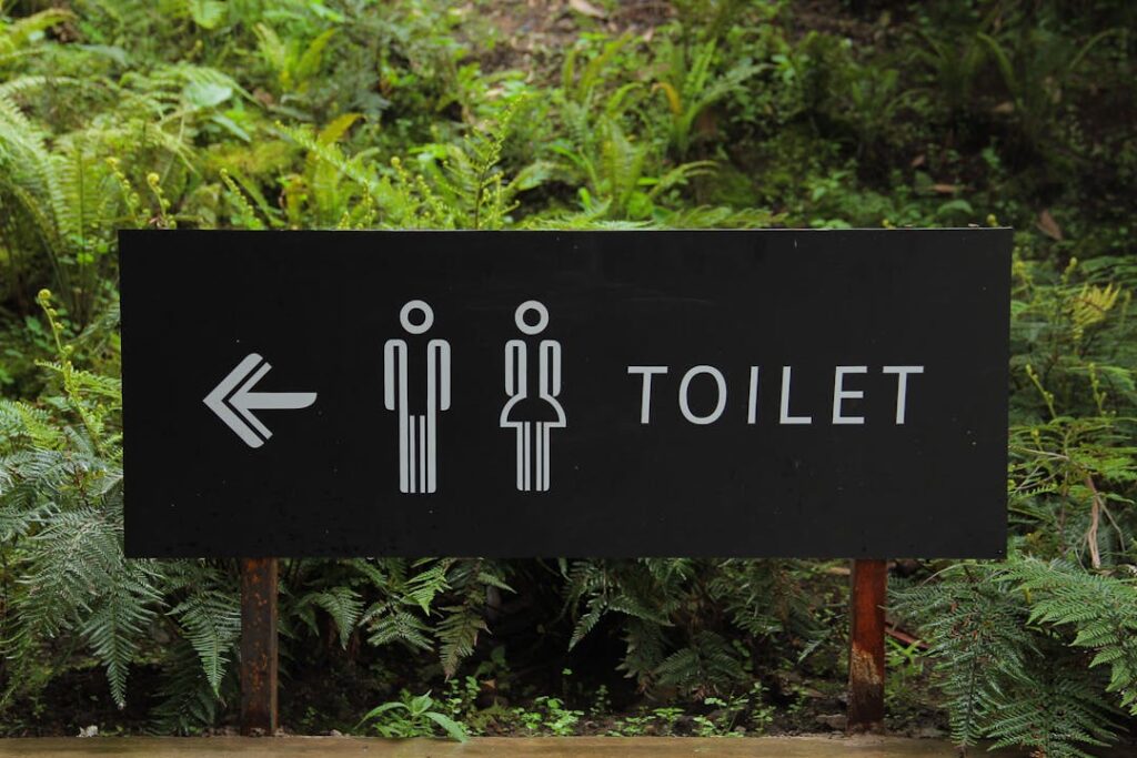 A washroom direction signage