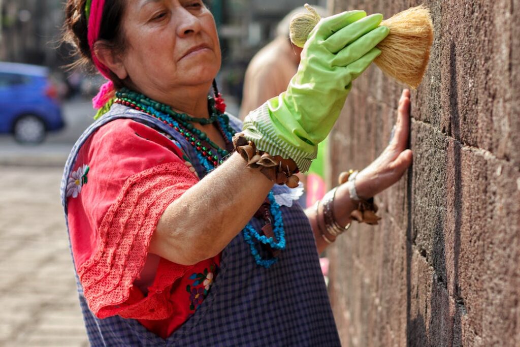 A lady cleaning walls